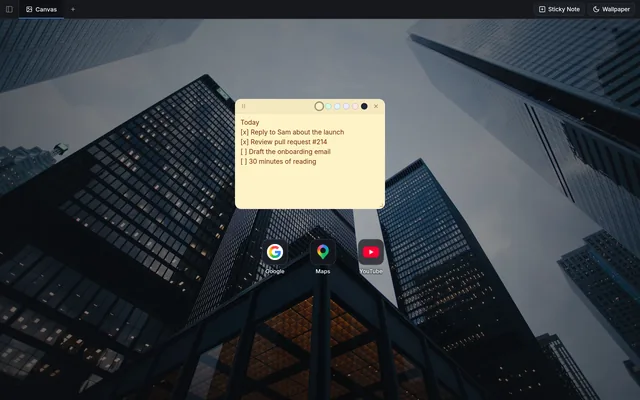 City towers wallpaper with a yellow sticky note and three shortcuts.